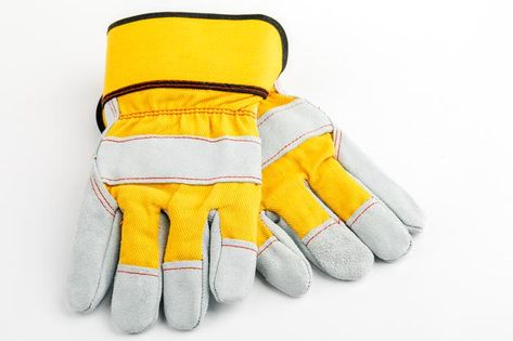 Pair of yellow construction gloves on a ... | Premium Photo #Freepik #photo #background #hand #building #construction