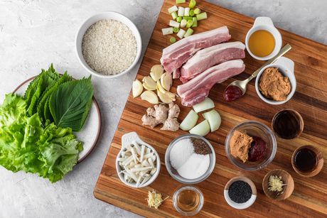 Korean Pork Belly Recipe (Bossam) Bossam Korean Pork Belly, Bossam Korean, Korean Lettuce Wraps, Korean Pork Belly, Korean Pork, Pork Belly Recipes, Pickled Cabbage, Pickled Radishes, Kimchi Recipe