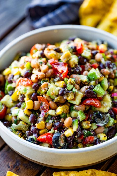 Cowboy caviar is a delicious dip packed with beans, avocados, corn and loads of more southwestern flavors! A perfect side or appetizer. #cowboycaviar #cowboycaviarrecipe #texascaviar #salsarecipe Easy Bbq Side Dishes, Cowboy Caviar Recipe, Stew Dinner, Amazing Salads, Caviar Recipes, Oh Sweet Basil, Bbq Side Dishes, Cowboy Caviar, Chicken Curry Salad