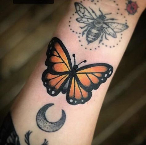 Monarch Butterfly done by Nick Monthei at Big Guns in Oshkosh WI. I like to call this my bug arm! Traditional Purple Tattoo, Monarch Butterfly Tattoo Simple, American Traditional Monarch Butterfly Tattoo, Orange Monarch Butterfly Tattoo, Traditional Butterfly Tattoo Color, Lacey Tattoos, Traditional Monarch Butterfly Tattoo, Old School Butterfly Tattoo, Monarch Tattoo