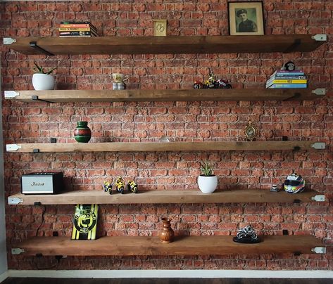 Scaffold Board Shelves Bedroom, Floating Shelves Brick Wall, How To Hang Shelves On Brick Wall, Brick Wall Bookshelves, Long Rustic Shelves, Brick Wall Shelving, Scaffolding Board Shelves, Brick Wall With Shelves, Brick Wall Shelves