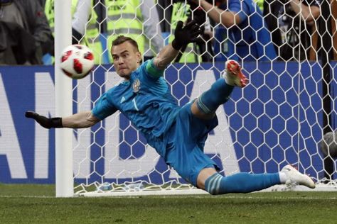 MOSCOW (REUTERS) - Russia's penalty shootout hero, goalkeeper Igor Akinfeev, thanked God, luck and the Luzhniki Stadium crowd for bringing the hosts home safely against Spain on Sunday (July 1) to reach their first World Cup quarter-final since 1970.. Read more at straitstimes.com. Igor Akinfeev, Diego Costa, First World Cup, New Today, World Of Sports, Bayern Munich, Football Boots, Fifa World Cup, Football Fans