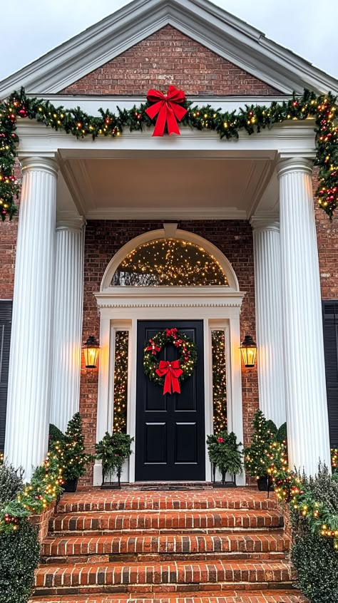 Festively decorated house entrance with garlands, lights, and wreaths, creating a warm Christmas atmosphere. Wreaths On Windows Outdoor, Wreaths On Windows, Decor With Lanterns, Brick Steps, Outdoor Christmas Decoration Ideas, Wooden Terrace, Outdoor Christmas Decor, Christmas Front Doors, Festive Wreath