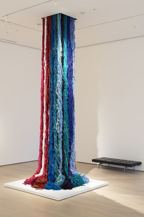 Sheila Hicks. Pillar of Inquiry/Supple Column. 2013–2014 “I want my work to hit the floor in a very emphatic way, so it...spills, puddles, and looks as though it's alive. It's moving and has its own internal energy” “In all of the cultures of the world, textile is a crucial and essential component…. There’s a level of familiarity that immediately breaks down any prejudice” “I think that is important, the wanting: the desire to hold it in your hands, to befriend it, to see if it bites, or if it’s Fabric Installation Art, Art With Yarn, Exhibition Design Ideas, What Is Contemporary Art, Encaustic Art Techniques, Sheila Hicks, Fabric Installation, Textiles Ideas, Art Alevel