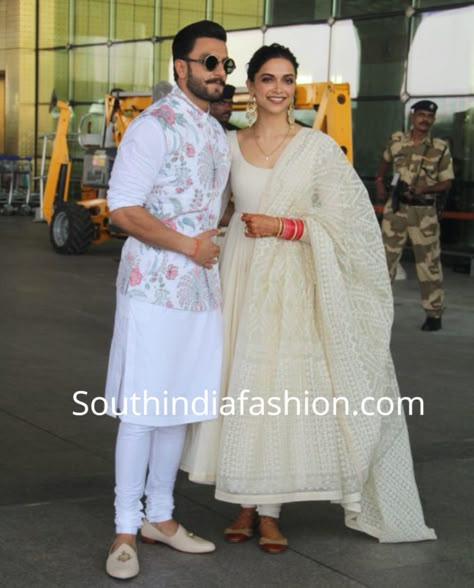 DEEPIKA PADUKONE WHITE ANARKALI AIRPORT White Anarkali Suit Designs, Deepika White Anarkali, Deepika Padukone In Suit, White Anarkali Designs Indian, White Anarkali Kurta Designs, Deepika Padukone Anarkali Suits, Chikenkari Dress Ideas Kurti White, Deepika Padukone White Dress, Anarkali Designs For Wedding