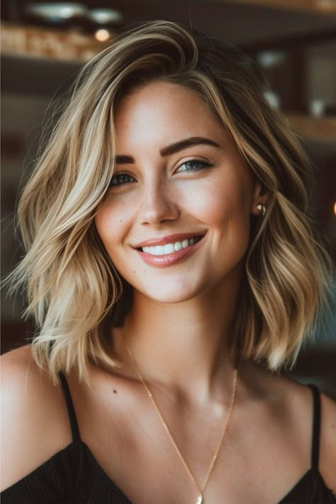 This textured lob with a side part falls gracefully above the shoulders. Soft waves throughout add volume to the classic bob silhouette, and balayage highlights bring a sun-kissed dimension to this layered cut. Click here to see more stunning medium-length layered haircuts. Shoulder Haircut, Mom Haircuts, Shoulder Hair, Lob Hairstyle, Lob Haircut, Shoulder Length Hair Cuts, Haircuts For Medium Hair, Medium Hair Cuts, Shoulder Length Hair