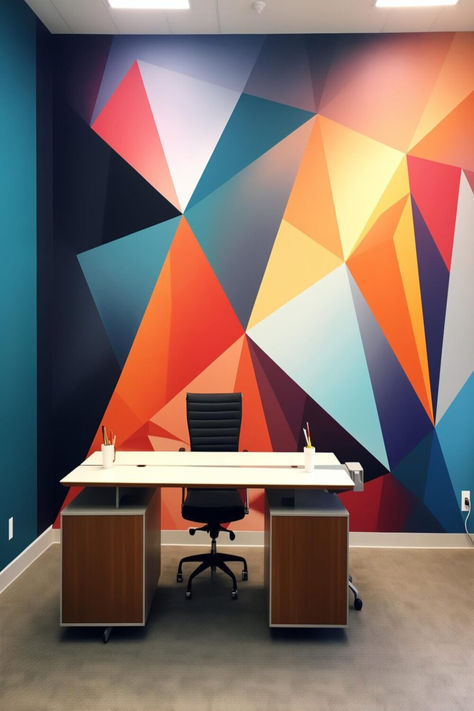 Contemporary office interior featuring a colorful geometric accent wall, modern furniture, and bright space. Office Geometric Wall Design, Geometric Wallpaper For Office, Triangle Geometric Pattern Wall, 3d Geometric Feature Wall, Corporate Wall Design Graphics, Geometric Accent Wall, Office Feature Wall, Bold Paint Colors, Innovative Office