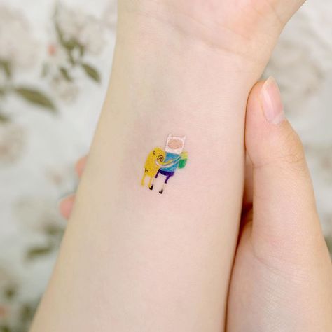 STUDIOBYSOL_ovenlee on Instagram: “Adventure Time with Finn & Jake (2cm) ⠀ ✨Sydney Guest work🇦🇺 8th Jan - 19th Jan ovenleetattoo@gmail.com ⠀ @ovenlee.tattoo” Finn And Jake Tattoos, Adventure Time Stick And Poke, Adventure Time Tattoo Matching, Adventure Time Matching Tattoos, Small Adventure Time Tattoo, Finn And Jake Tattoo, Ovenlee Tattoo, Finn Tattoo, Jake Tattoo