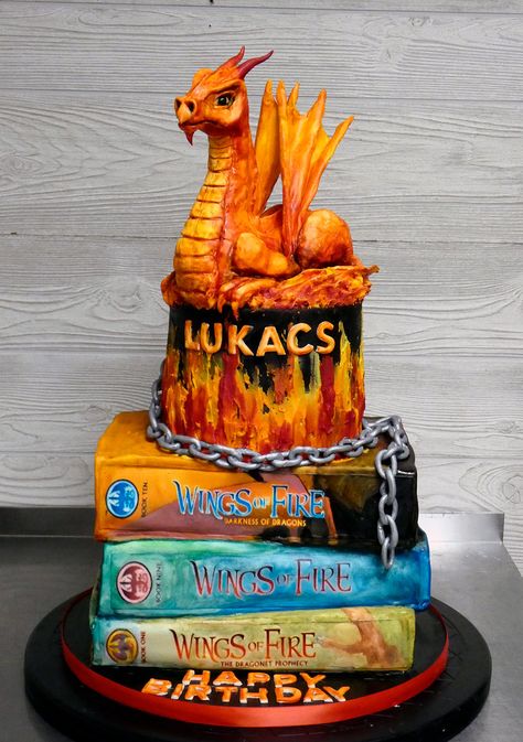 Only thing better than birthday cake is birthday cake with a dragon on it! Bottom two books were chocolate cake. Top book and top tier were vanilla cake. Dragon was sculpted from Rice Krispies Treats and covered with fondant, then painted. Chain and wings were made of gumpaste. Dragon Scale Cake Tutorial, Dragon Cake Tutorial, Wings Of Fire Cupcakes, Wings Of Fire Cakes, Wings Of Fire Themed Birthday Party, Wings Of Fire Cake Ideas, Wings Of Fire Birthday Cake, Wings Of Fire Birthday Party Ideas, Wings Of Fire Cake