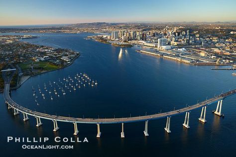 San Diego Coronado Bridge, known locally as the Coronado Bridge, links San Diego with Coronado, California.  The bridge was completed in 1969 and was a toll bridge until 2002.  It is 2.1 miles long and reaches a height of 200 feet above San Diego Bay.  Coronado Island is to the left, and downtown San Diego is to the right in this view looking north. San Diego, California, USA, natural history stock photograph, photo id 22288 Coronado Island San Diego, Coronado Bridge, Coronado Island, San Diego Bay, Hotel Del Coronado, San Diego Travel, Last Ride, Downtown San Diego, San Diego County