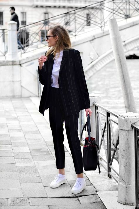 black pinstripe suit and white sneakers. Visit Daily Dress Me at dailydressme.com for more inspiration          women's fashion 2018, summer fashion, suits, menswear Suit And White Sneakers, Suits And Sneakers, Black Pinstripe Suit, Moda Paris, Mode Casual, Pinstripe Suit, Trending Sneakers, Daily Dress, Fashion 2018