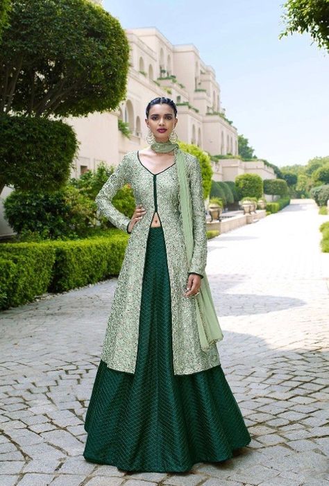 Magnify the wedding pageant by adorning this dress in bottle green and pista color. This dress is designed with pristine all over embroidery and lace work. The dress comes with bhagalpuri top and bhag Bottle Green Combination Outfit Indian, Pista Green Lehenga Combination, Bottle Green Lehenga Combinations, Pista Green Suit Combination, Indian Frocks, Pista Green, Mode Abaya, Indian Gowns Dresses, Desi Clothes