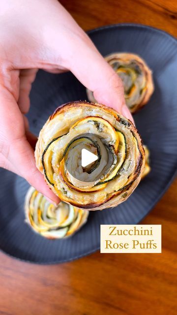 Guntas Sethi on Instagram: "✨Zucchini Rose Puffs✨

This recipe is like hitting two targets with one arrow! Not only will you impress your guests, but you’ll also sneakily make a veggie taste absolutely lip-smacking!🤤🫶🏽

The filling hits all the right spots—so creamy, and the outer layer is perfectly crunchy! One of the best appetizers to serve while hosting 🥰🤌🏼

Recipe:

-1 tbsp oil
-1 tbsp garlic 
-1 cup spinach, finely chopped 
-1 tbsp chilli flakes 
-1 tbsp Italian seasoning 
-salt as per taste 
-1/2 cup cream cheese 
-Puff Pastry sheets 
-yellow & green zucchini 

🥒 Bake it at 180* for 20-25mins 

#zucchinirosepuffs #partyappetisers #veggiesnacks #puffrecipes #creamyfilling #homemaderecipes 

[Zucchini Rose Puffs, crispy snacks, baked appetisers, recipes reels, Chef Guntas]" Zucchini Puff Pastry Recipes, Zucchini Roses Puff Pastry, Hosting Recipes, Kalakand Recipe, The Best Appetizers, Crispy Snacks, Vegetarian Party Food, Savoury Tarts, Baked Appetizers