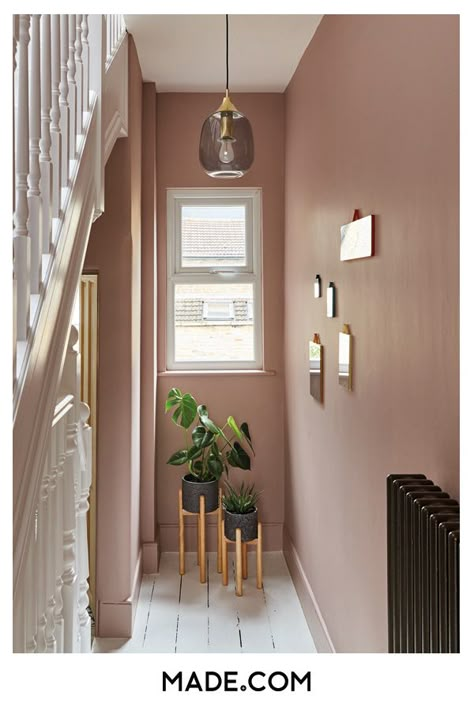 Plaster pink walls brighten the staircase. Add terrazzo planters for an on-trend statement and a pendant light to make the most of vertical space Hallway Decorating Colours, Hallway Colour Ideas, Hallway Colour Schemes, Pink Hallway, Entrance Hall Decor, Hallway Paint, Hallway Colours, Hallway Inspiration, Narrow Hallway Decorating