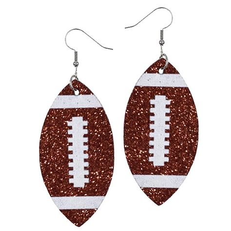 PRICES MAY VARY. Silicone plug closure Football earrings for women for those who wear their passion for football league. This single-layered faux PU football mom accessories are symbolic to our love for football. Wear them in style and style them with pride. The glittering layer of these leather football jewelry would give an added edge to your look. Grab this mocha football jewelry today for yourself or gift it to your bestie. Style: Everyday danglers, Sports love Material: Silver plated with f Team Mom Football Gifts, Team Mom Football, Football Team Gifts, Football Jewelry, Mom Earrings, Football Earrings, Glitter Jewelry, Mom Accessories, Double Sided Earrings