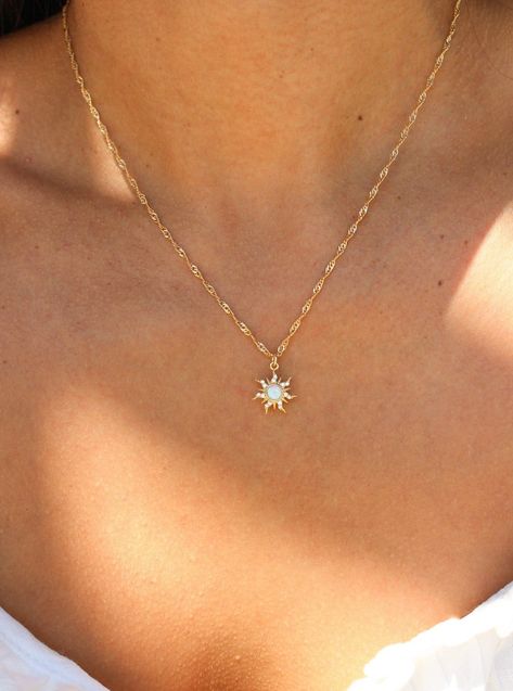 Embrace your inner princess with our Cassie Necklace. She features a gold filled chain, which makes it an elegant everyday necklace. Its dainty opal sun charm easily adds a pop of color to any outfit, ensuring you always stand out. This shiny piece is perfect for necklace layering or equally beautiful worn alone. Best of all, this necklace is tarnish free ! • Single Gold filled chain (of choice) with charm• Gold Filled• Bead Chain Length: 20"• Twist Chain Length: 16" + 1" extender (to make adjus Necklace Dainty Gold, Jewelry Gold Dainty, Casual Gold Jewelry, Single Charm Necklace, Small Dainty Jewelry, Dainty Sun Necklace, Simple Cute Jewelry, Dainty Gold Pendant, Simple Dainty Jewelry