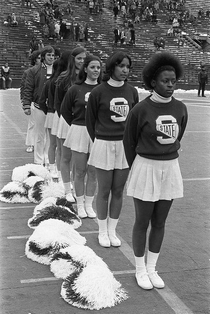 Cheerleaders at the MSU vs Northwestern football game, 1972 by Michigan State University Archives, via Flickr Cheerleader Outfits Aesthetic, 1920s Cheerleader, Vintage Cheer Uniform, Vintage Cheerleader Aesthetic, Vintage University Aesthetic, School Spirit Aesthetic, 70s Cheerleader, Vintage Cheerleader, Cheerleader Uniforms