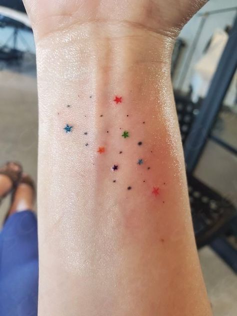 Tattoo Freckles Colorful, Colourful Star Tattoo, Teeny Tiny Tattoo Ideas, Confetti Tattoo Ideas, Pretty Color Tattoos, Star Tattoo Color, The Rest Is Confetti Tattoo, Simple Colorful Tattoos, Sprinkles Tattoo