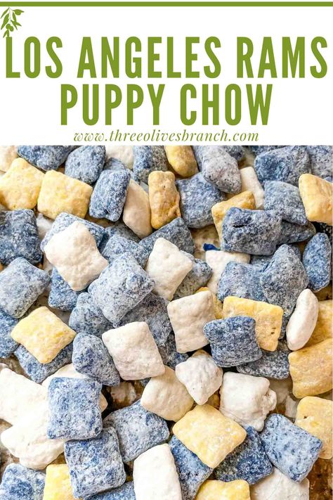 Los Angeles Rams Puppy Chow is a perfect way to cheer for your favorite football team on game day and the Super Bowl! Muddy buddies made with LA Rams colors of navy blue, yellow, and white. A sweet and salty snack that is gluten free Super Bowl recipe. Michigan Wolverines Party Ideas, Snacks For Blue Collar Men, Blue And Yellow Food Ideas, Michigan Tailgate Food, La Rams Birthday Party Ideas, Colored Puppy Chow, Blue And Yellow Desserts, Blue Snacks For Party, Blue Puppy Chow