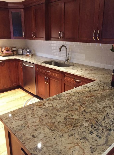 Typhoon Bordeaux granite countertops are the focal point of this kitchen.  Warm cherry cabinets and a simple white beveled subway tile complete the space.  Kitchen by Stoneshop from Cherry Hill, NJ. Affordable Kitchen Countertops, Wood Tile Kitchen, Replacing Kitchen Countertops, Kitchen Island With Sink, Budget Kitchen Remodel, Kitchen Tiles Design, Tuscan Kitchen, Granite Countertop, Cherry Cabinets