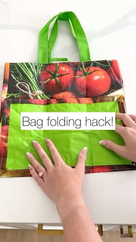 We are totally obsessed with this shopping bag folding hack!✨ Who here has wayyy to many of these?🙋🏻‍♀️ #everythingenvy #folding… | Instagram Folded Shopping Bag Pattern, Folding Reusable Bags, Shopping Bags Storage, Organizing Reusable Grocery Bags, Shopping Bags Organization, Fold Grocery Bags, How To Store Reusable Shopping Bags, Fold Reusable Grocery Bags, How To Fold Reusable Bags Shopping