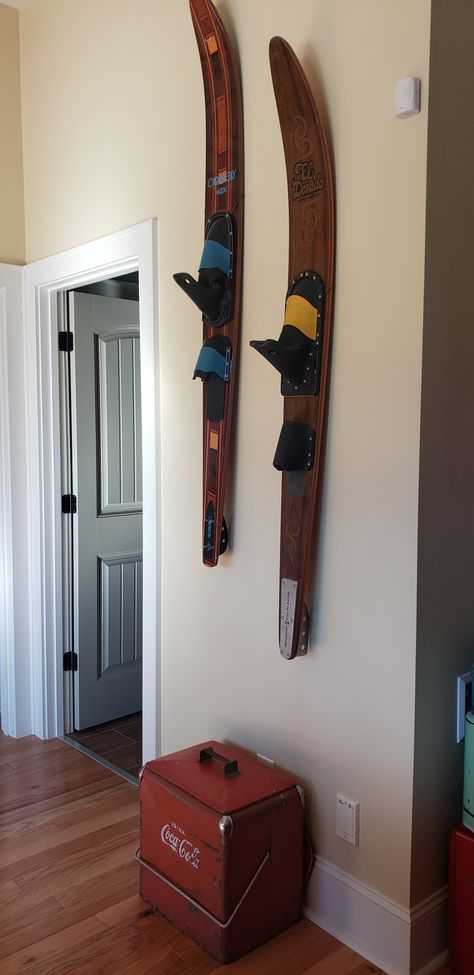 Hanging water sports equipment gives an interesting vibe to a lake house basement. Old Water Skis Ideas, Waterski Decor Ideas, Water Ski Decor Ideas, Water Ski Decor, Lake House Basement, Nautical Home Decorating, Vintage Cooler, House Basement, Lake Ideas