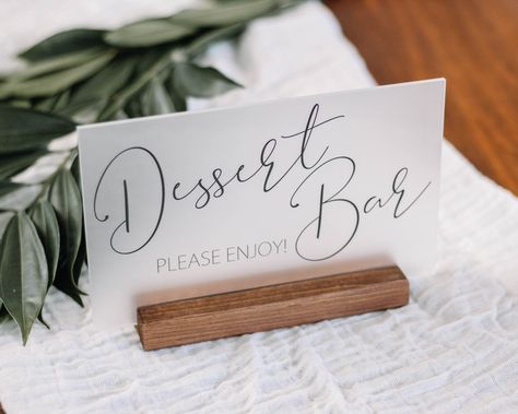 "Your day is so sweet, why not add a dessert bar to finish everything off!  -DETAILS- 5\" x 8\" Frosted Acrylic Black or White lettering 6\" Walnut or Gray stained Base Everyone deserves to indulge in their sweet tooth, let you guests know to treat themselves with our dessert bar sign. The sleek design is featured on a frosted acrylic and held with a slim wood base for a classic feel to match any decor. Choose your color combination choice for something even a little more personalized! It is alw Cake Table Sign, Guest Book Table Decor, Rustic Dessert Table, Unique Wedding Signs, Wedding Guest Book Table, Sweets Bar, Diy Dessert, Wedding Memorial Sign, Bar Signage