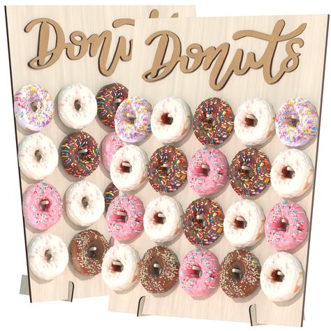 PRICES MAY VARY. STABLE DONUT WALL BOARD : Our donut wall stand for party is made of thick wooden materials, much stronger than cardboard. Stable bottoms make it perfectly standing at your party dessert table, your guests would be happy to take a donut from the donut wall without worrying about messing it up. 20 PEG LARGE DONUT DISPALY : Our donut wall board size: 17.7" x 15", Just fix the donut wall on the bottom feet and put the pegs in, and prop it. 2 pack large donut wall can accommodate 40 Donut Grow Up Party, Doughnut Stand, Donut Holder, Birthday Cake Alternatives, Donut Party Decorations, Donut Display, Donut Stand, Wall Stand, Grown Up Parties