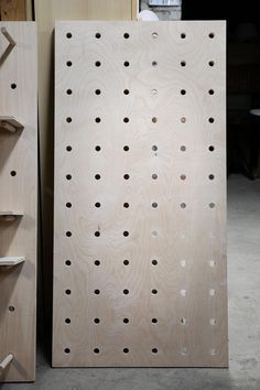 An Easy-ish DIY: Oversize Plywood Pegboard with Shelves - The Organized Home Peg Board Diy, Pegboard Headboard, Plywood Pegboard, Diy Peg Board, Large Pegboard, Peg Board Walls, Wooden Pegboard, Peg Wall, Pegboard Display