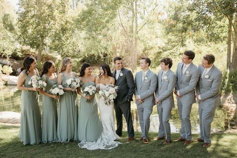 boho summer wedding with sweeping draping, pampas grass, and neutral-colored blooms Bridal Party Sage Green And Grey, Sage Green And Grey Wedding Party, Sage Green Country Wedding Groomsmen, Sage Green Gray Wedding, Sage Green And Light Grey Wedding, Sage Green Bridesmaid Dresses Gray Suits, Dusty Green Groomsmen Attire, Sage Green And Grey Groomsmen, Dusty Rose And Sage Green Wedding Party Attire