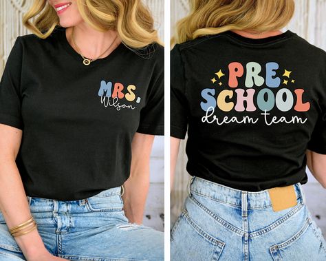 You will have the most stylish teacher team in the school with these shirts! This is also a great gift for a new teacher.  Leave the name you would like in the box provided SIZE UP 1-2 SIZES FOR THAT OVERSIZED LOOK   Thanks so much for shopping with me! Please message me with any questions you may have! I am always available to help :) Also, I would love to feature you on our insta if you want to tag me @poppyroseclothing    PRODUCTION TIME: 1-3 business days    SHIPPING TIME: 2-5 business days   PRODUCT DESCRIPTION: Bella Canvas Unisex T-shirt Super soft cotton and excellent quality print makes. 100% Soft cotton (fibre content may vary for different colors) Light fabric (4.2 oz/yd² (142 g/m Runs true to size CARE INSTRUCTION: Machine wash: cold,  Tumble dry: low heat, do not iron directly Prek Teacher Shirt, Preschool T Shirts For Teachers, Tshirt Teacher Outfits, Teacher Name Shirt, Preschool Shirt Ideas, Preschool Teacher Tshirt Ideas, Preschool Teacher Tshirts, Prek Teacher Shirts Designs, Preschool Teacher Shirts Designs