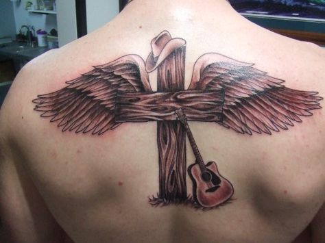 I would get this as a memorial to my great grandpa that recently passed away.  Instead of a guitar it would be a western saddle.  And instead of a tan hat it would be black. Christian Cowboy Tattoo, Western Memorial Tattoos, Croissant Tattoo, Wooden Cross Tattoos, Rip Tattoos For Dad, Grandpa Tattoo, Brother Tattoo, Rip Tattoos, Blessed Tattoos