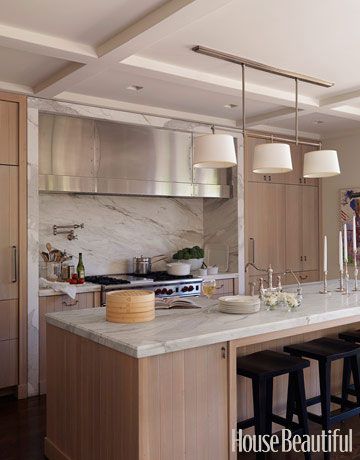 William Hefner's modern Los Angeles kitchen shows off the beauty of wood with cabinets that are made from solid pieces of rift-cut oak washed with a semi-transparent gray stain. To balance the look, he topped the counters and framed the range area with a warm Calacatta gold marble, for a style that's still soft. - HouseBeautiful.com Modern Wood Kitchen, Oak Kitchen Cabinets, Kitchen Details, Countertop Design, Kitchen Hoods, Oak Kitchen, Gorgeous Kitchens, Kitchen Marble, Kitchen Pictures