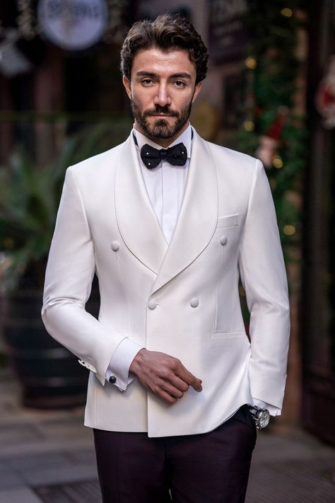 Elevate your wedding attire with the White Slim-Fit Tuxedo 3-Piece. The sleek white color and impeccable tailoring provide a look of distinguished elegance, perfect for your big day. Ensure you stand out as the groom with a tuxedo that radiates sophistication and charm, making your wedding day truly special.  #doublebreasted #whitetuxedo #tuxedo #suit #suits #slimfit #menstyle #menfashion #fashioninspo Luxury Men's Tuxedo With Pressed Crease, Single Button Double Breasted Suit, Luxury Cream Tuxedo Suit, Luxury Wedding Suits With Pressed Crease, Luxury White Ceremonial Unstitched Suit, Luxury White Cambric Unstitched Suit, Luxury White Double-breasted Suit For Workwear, Luxury White Tuxedo Style Outerwear, Luxury White Suit For Wedding Guest