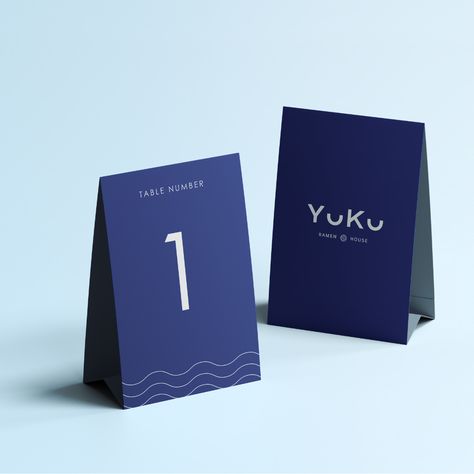 Brand Identity implemented onto a table number stand for the Japanese restaurant Yuku. Table Number Design, Japanese Ramen Restaurant, Restaurant Table Numbers, Table Number Stand, Ramen House, Table Number Stands, Ramen Restaurant, Ramen Shop, Restaurant Table