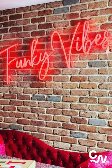 Red Brick Accent Wall, Neon Sign On Brick Wall, Logo On Brick Wall, Brick Wall With Neon Sign, Neon Sign In Restaurant, Brick Wall Neon Sign, Neon Brick Wall Background, Wall Word Lights Neon Signs, Colorful Shelf