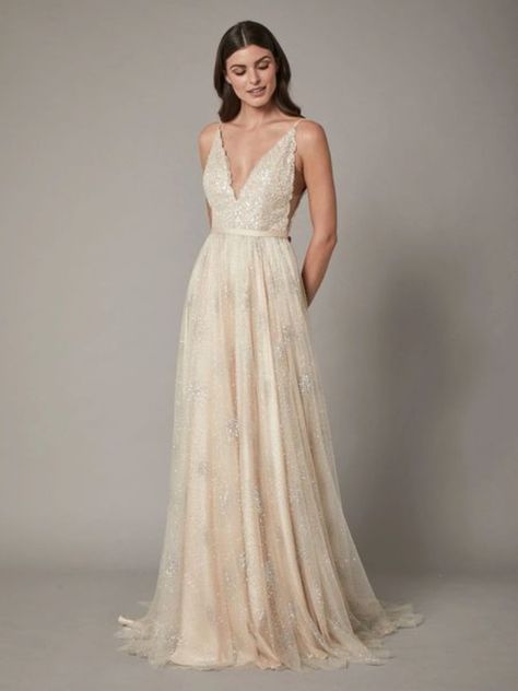 This Catherine Deane wedding dress is dripping with sparkly details all over the dress!