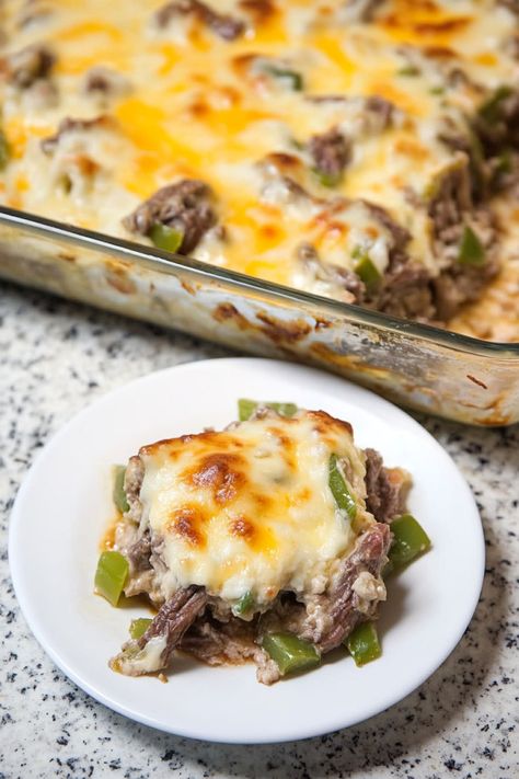 Indulge in the rich flavors of a classic Philly cheese steak with a delicious twist in this mouthwatering casserole recipe. Layers of thinly sliced beef, caramelized onions, colorful bell peppers, and melted cheese come together perfectly to create a satisfying dish that's perfect for sharing with family and friends. Whether you're looking for a cozy weeknight dinner or planning a gathering, this cheesy casserole will surely become a new favorite at your table. Steak And Cheese Casserole, Philly Steak Casserole, Savory Casserole, Philly Cheese Steak Casserole Recipe, Philly Cheesesteak Casserole, Sautéed Peppers, Cheesesteak Casserole, Steak Casserole, Philly Cheese Steak Casserole