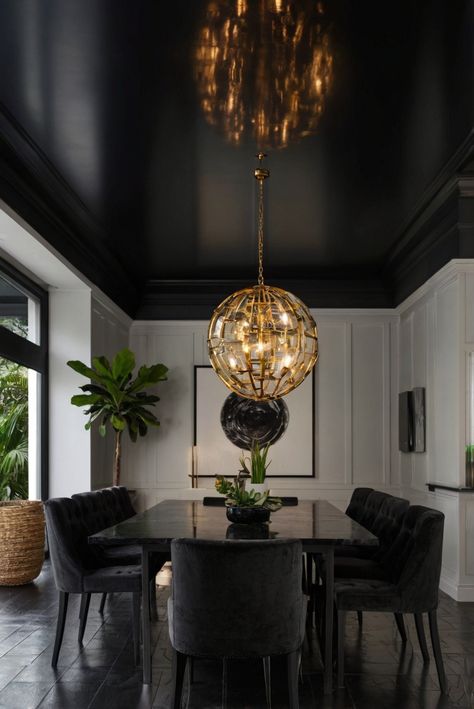 Black Ceiling Chic: 16 Designs to Inspire Your Bold Choice! (Plus Tips) - upgradesign.blog Dining Room With Black Floors, Black Luxury Dining Room, Low Ceiling Dining Room Ideas, Cool Color Interior Design, High Gloss Black Ceiling, Award Winning Interior Design, Dining Room Accent Ceiling, Black Ceiling Interior, Green Walls Black Ceiling