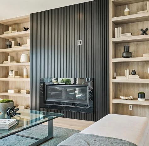 Timeless Contemporary Interior, Modern Sleek Fireplace Wall, Matte Black Fireplace Wall, Modern Fireplace Bookshelves, Modern Stair Landing Decor Ideas, Black Fluted Fireplace Wall, Black Wood Slat Fireplace, Modern Wood Slat Fireplace Wall, Black And Wood Fireplace Wall