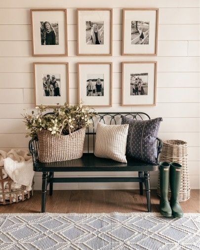 Front Hallway Bench Ideas, Front Entrance Bench Decor, Black Bench In Entryway, Black Farmhouse Bench Entryway, High Back Bench Entryway, Bench Under Photo Wall, Black Metal Bench Entryway, Bench Front Entryway, Front Entry Bench Farmhouse