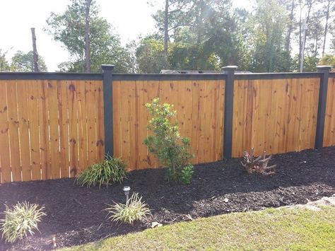 wood fence with black top and black posts Elite Fencing Black Wooden Fence Backyards, Horizontal Driveway Gate, Backyard Fence Before And After, Wood Fence Black Posts, Farmhouse Fence Ideas Front Yards Wood, Black Fence Posts, Black Fence Backyard Wood, Black House With Fence, Wooden Privacy Fence Styles