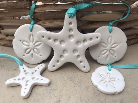 Porcelain Starfish and Sand dollar ornaments, different sizes available, bag tags, coastal wedding, handmade ceramic, turquoise, blue by AmberleByrne on Etsy Ceramic Sand Dollar, Starfish Polymer Clay, Sand Dollar Wedding Favors, Ceramic Starfish, Sand Dollar Ornament, Sand Dollar, Coastal Wedding, Fine Porcelain, Handmade Ornaments