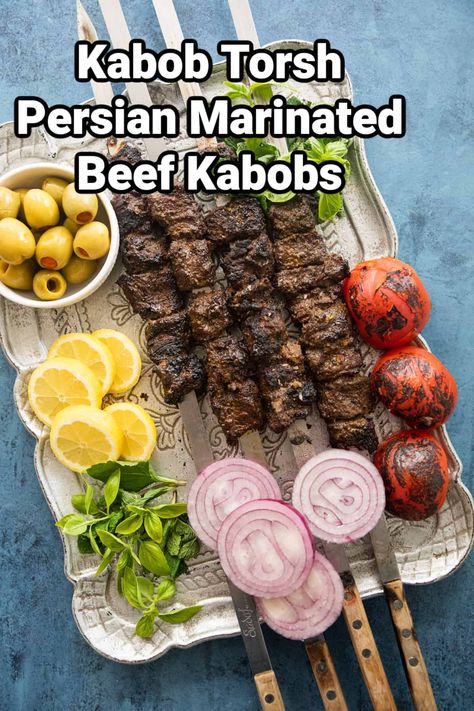 Kabob Torsh is a unique Iranian dish made with juicy beef marinated in pomegranate molasses, walnuts and herbs. This unique beef kabob is from North of Iran and is usually served with rice. Persian Beef Kabob, Persian Beef, Marinated Beef Kabobs, Persian Pomegranate, Beef Kabob Marinade, Persian Dishes, North Of Iran, Kabob Marinade, Iranian Dishes