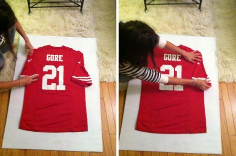 DIY Framed Jersey | Can't wait to frame my son's old football jerseys for his room :) Framed T Shirt Display, Ideas For Old Baseball Jerseys, Framed Soccer Jersey Ideas, Display Jerseys Ideas, Old Jersey Ideas, Display Football Jersey, Football Room Man Caves, How To Hang A Jersey On A Wall, Framed Soccer Jersey