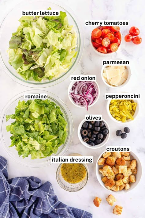 This Simple Italian Salad is loaded with olives, pepperoncini, red onion, and cherry tomatoes and tossed with a zesty Italian dressing. This easy side dish salad takes just minutes to make and is perfect to serve with pasta or a wide variety of meals. Salad Recipes With Italian Dressing, Side Dish Salads Simple, Salad Simple Recipes, Healthy Simple Salads, Salads With Italian Dressing, Simple Easy Salad Recipes, Salads That Go With Italian Food, Salad With Italian Food, Homemade Italian Salad