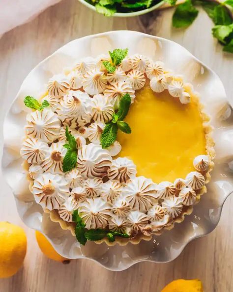 Summertime means get-togethers with family and friends, and what better way to impress your guests than with a dessert that is both beautiful and delicious? This from-scratch lemon meringue tart has a buttery vanilla shortbread crust, bright and creamy lemon filling, and beautiful Italian meringue. It's practically begging for center stage at your next party! Easy Lemon Meringue Pie Recipe, Easy Lemon Meringue Pie, Easy Lemon Meringue, Sweets Design, Lemon Meringue Pie Easy, Lemon Meringue Pie Recipe, Vanilla Shortbread, Decorating Desserts, Simple Sugar Syrup