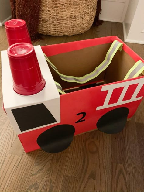 Fire Truck Box Costume, Fire Truck Box Diy, Fire Truck Diy Cardboard Boxes, How To Make A Fire Truck From Cardboard, Diy Firetruck Costume, Firetruck Halloween Costume, Diy Fireman Costume Kids, Diy Fire Truck Costume, Fire Truck Costume Diy