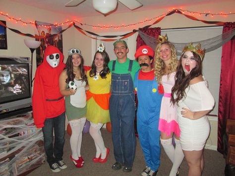 Mario characters Halloween costume! Shy Guy, Yoshi, Princess Daisy, Luigi, Mario, Princess Peach, and King (Queen) Boo. Boo From Mario Costume, King Boo Halloween Costume, Luigi And Daisy Costume, Diy Mario Character Costumes, King Boo Costume, Daisy Costume Diy, Mario Party Costume, Daisy Luigi, Queen Boo