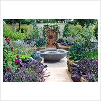 Kitchen garden with water feature, herbs and vegetables planted in raised beds made with Woven willow and cedar wood - GAP Photos Garden Australia, Rhs Chelsea Flower Show, The Garden Of Eden, Potager Garden, Veg Garden, Plant Photography, Chelsea Flower, Chelsea Flower Show, Plant Pictures